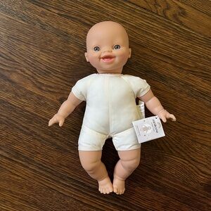 BNWT Minikane soft body doll.
